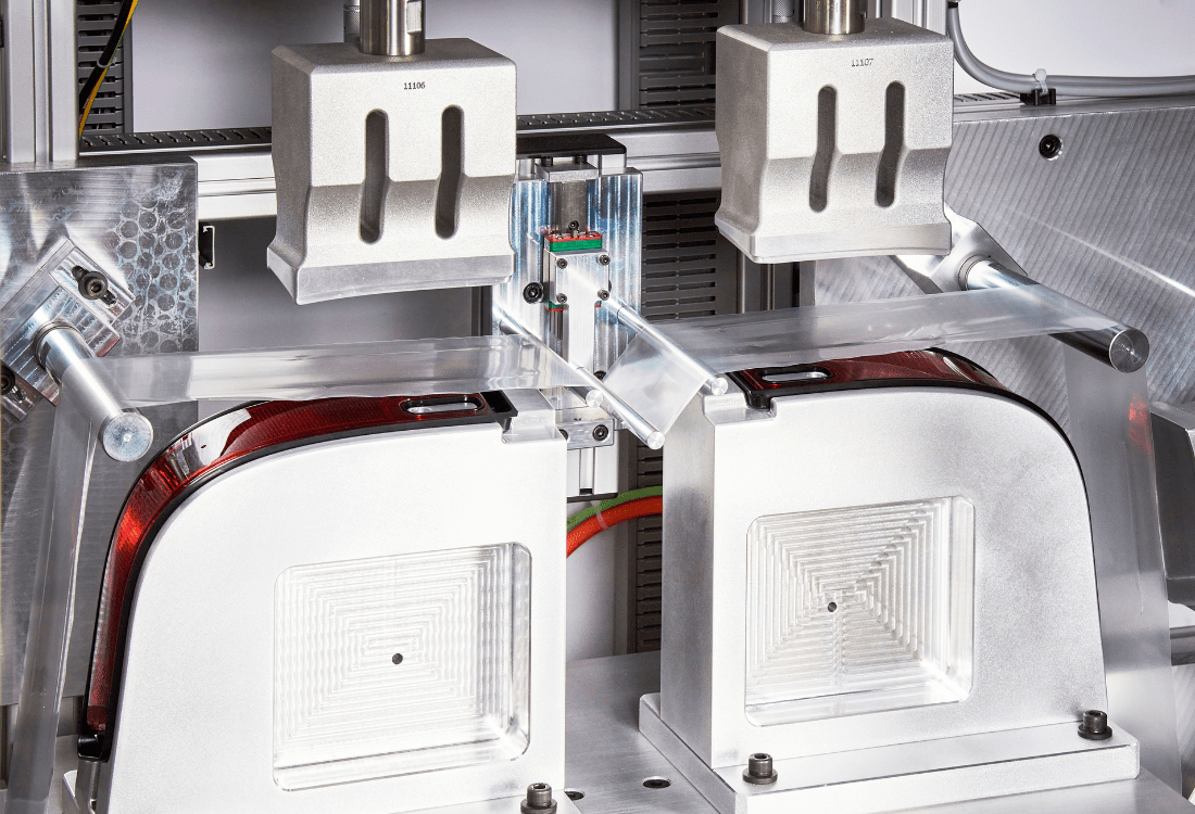 Close-up view of an ultrasonic plastic welding machine in operation, highlighting the precision equipment and components used to fuse materials with accuracy and efficiency.