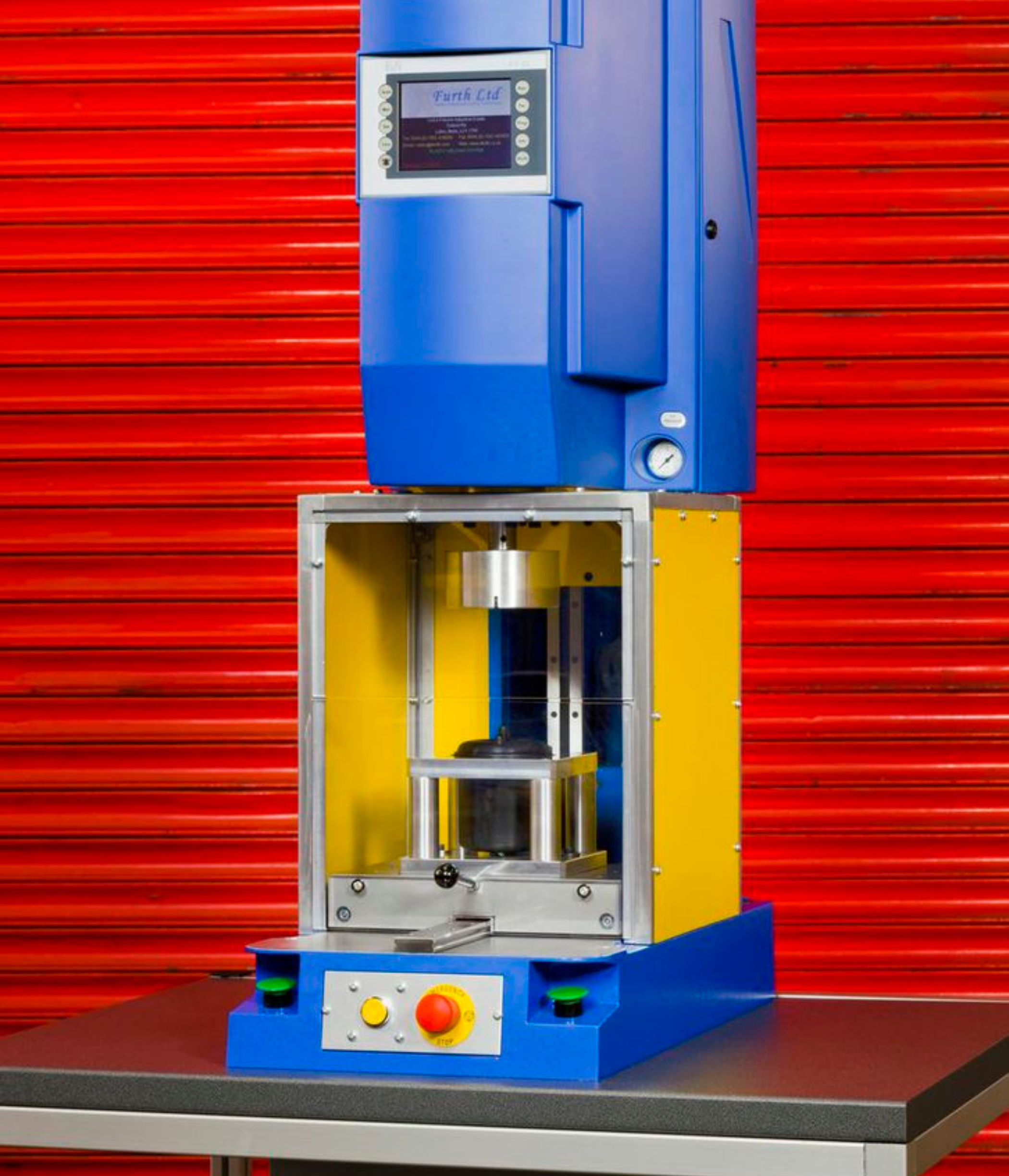 Industrial vibration welding machine with a blue vertical body and a yellow safety guard,  showcasing the advanced equipment used for creating seamless assemblies in manufacturing processes.